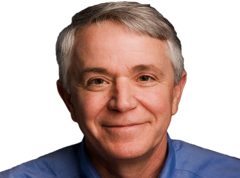Smiling middle-aged man in a blue shirt.