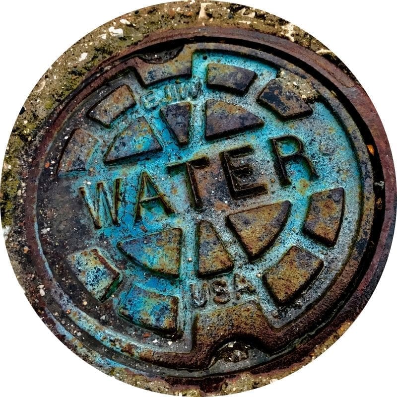 Rusty water manhole cover.
