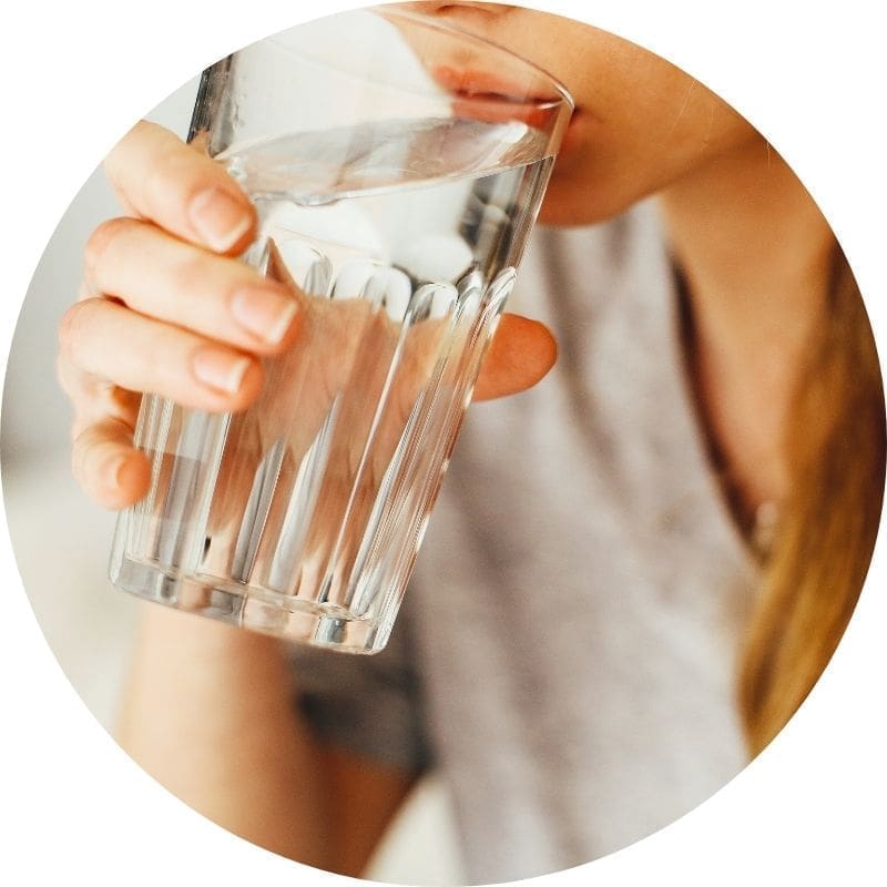 Person drinking from a glass.
