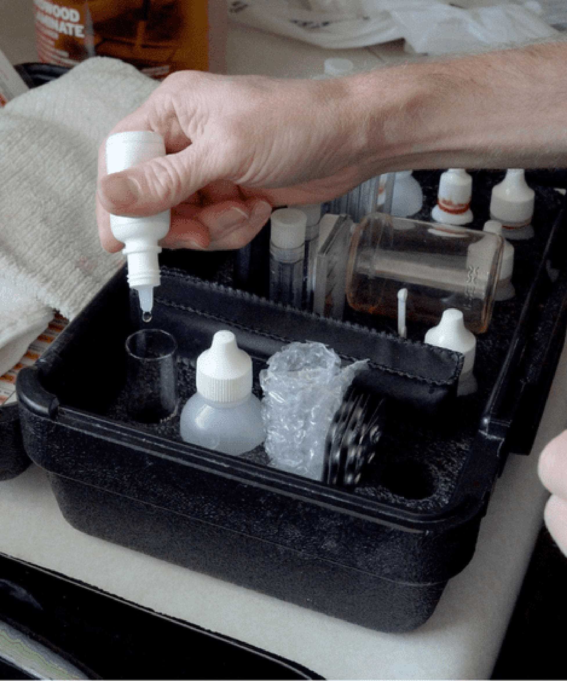 Technician performing a free water analysis using professional water testing equipment.